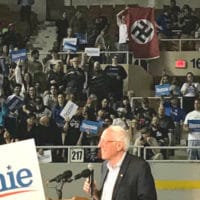 "Whoever it was, I think they're a little outnumbered tonight," Sen. Bernie Sanders (I-Vt.) said after the man with the Nazi flag was removed from the rally. (Photo: Screenshot/Bernie Sanders Campaign via Storyful)
