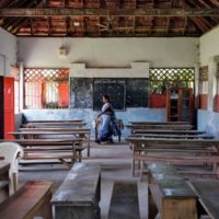 12 March 2020: A staff member inside an empty classroom of a school in Kochi, after the Kerala state government ordered schools across the state to close because of coronavirus fears. (Photograph by Reuters/ Sivaram V)