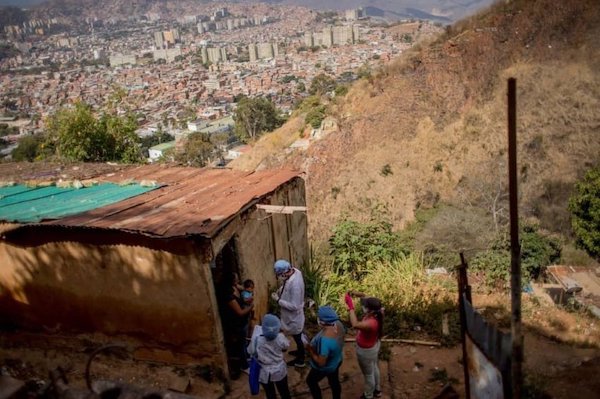 | A doctor and members of the local health committee visit a family in Alto de Lidice Caracas Venezuela Photo Gsus Garcia | MR Online
