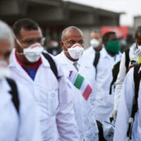 An emergency contingent of Cuban doctors and nurses arrive at Italy’s Malpensa airport after traveling from Cuba to help Italy in its fight against the coronavirus. Daniele Mascolo | Reuters