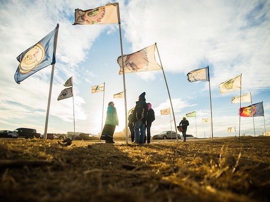 | Flags fly at the Oceti Sakowin Camp in 2016 near Cannonball North Dakota LUCAS ZHAO CC BY NC 20 | MR Online
