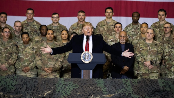 | FILE In this Nov 28 2019 file photo President Donald Trump center with Afghan President Ashraf Ghani and Joint Chiefs Chairman Gen Mark Milley behind him at right addresses members of the military during a surprise Thanksgiving Day visit at Bagram Air Field Afghanistan President Donald Trump starts the new year knee deep in daunting foreign policy challenges at the same time hell have to deal with a likely impeachment trial in the Senate and the demands of a reelection campaign AP PhotoAlex Brandon File | MR Online