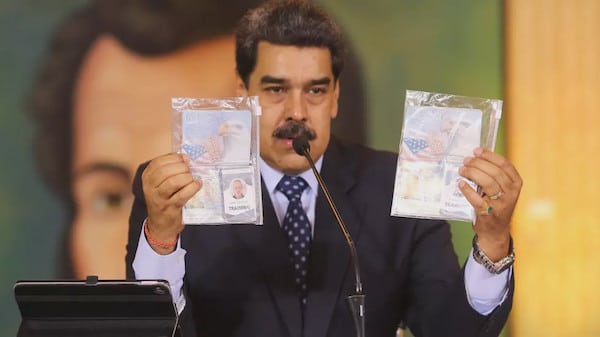 | Constitutional President Nicolas Maduro shows the passports of the two US Silvercorp mercenaries captured in Venezuela after the failed raid on Macuto Photo AFP | MR Online