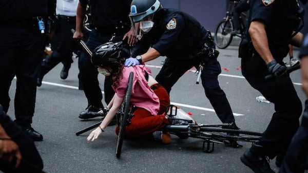 | A protester is arrested by NYPD officers for violating curfew beside the iconic Plaza Hotel on 59th Street Wednesday June 3 2020 in the Manhattan borough of New York Protests continued following the death of George Floyd who died after being restrained by Minneapolis police officers on Memorial Day AP PhotoJohn Minchillo | MR Online