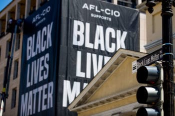 | A huge banner is hung from the AFL CIO building on part of 16th Street renamed Black Lives Matter Plaza in DC June 12 2020 Andrew Harnik | AP | MR Online
