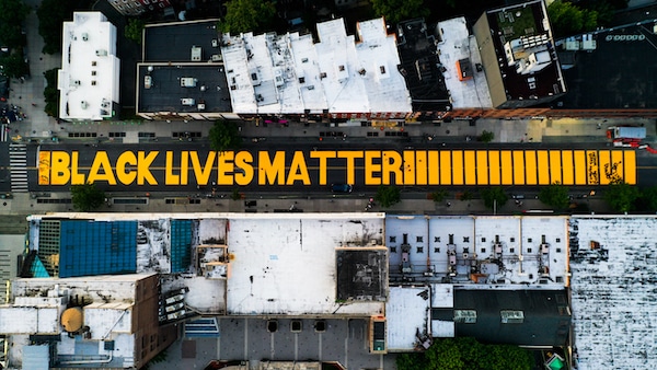 | A giant BLACK LIVES MATTER sign is painted in orange on Fulton Street June 15 2020 in Brooklyn New York John Minchillo | AP | MR Online