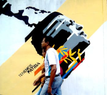 | This is our great homeland Tenemos Patria Grande La Candelaria Caracas 2013 Passersby in front of a mural that references the vision of a free and united Latin America following the vision of José Martí and the Bolivarian Revolution Comando Creativo | MR Online