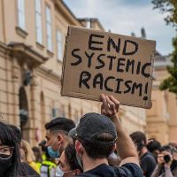'End systematic racism' (Photo: Pikist)