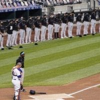 The New York Mets and Miami Marlins stand on the field and bow their heads before a scheduled baseball game ,before walking off in protest, Thursday, Aug. 27, 2020, in New York. (AP Photo/John Minchillo)