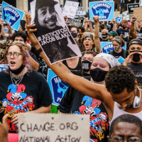 Protesters march near the Minneapolis 1st police precinct during a demonstration against police brutality and racism on August 24, 2020 in Minneapolis. (Photo: Kerem Yucel/AFP via Getty Images)