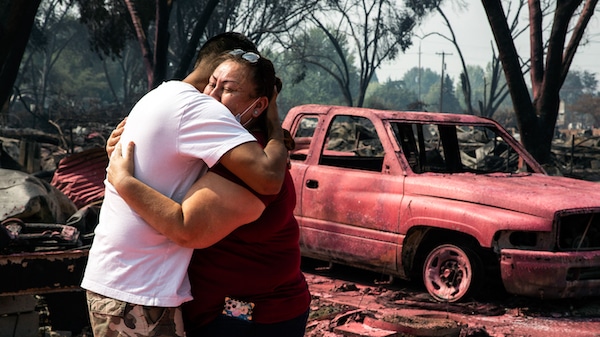 | Maria Centeno right from Mexico is consoled by her neighbor Hector Rocha after seeing their destroyed mobile homes at the Talent Mobile Estates Sept 10 2020 in Talent Ore after as wildfires devastate the region Paula Bronstein | AP | MR Online