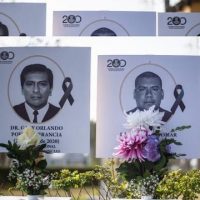 Images of more than 100 doctors who have died during the pandemic are displayed outside the Medical College of Peru PHOTO: AFP