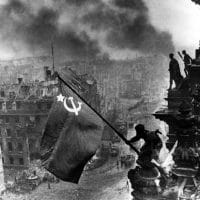 Yevgeny Khaldei’s iconic photo of the Red Army soldiers raising the Soviet flag on top of the Reichstag building in Berlin, May 1945.