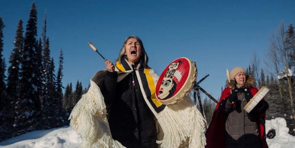 | Chief Howilhkat Freda Huson and her sister Chief Geltiy Brenda Michell stand in ceremony while she waits for police to enforce Coastal GasLinks injunction at Unistoten Healing Centre near Houston BC on Saturday February 8 2020 Amber Bracken | MR Online