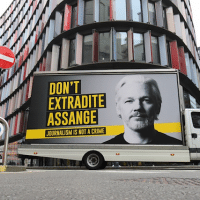 A mobile advertising board with a "Don't Extradite Assange" message outside the Old Bailey, London