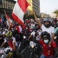 A caravan of demonstrators on motorcycles ride after interim President Manuel Merino resigned his post, in Lima, Peru, Sunday, Nov. 15, 2020. (AP Photo/Rodrigo Abd)