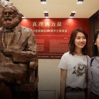 Header image: Two young women take selfies with a statue of Karl Marx and Friedrich Engels during an exhibition commemorating Marx’s 200th birthday in Beijing, May 5, 2018. Chen Xiaogen/People Visual