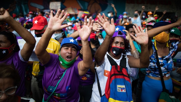 | Government supporters chant for parliamentary candidates representing the Great Patriotic Pole party at a closing campaign rally in Caracas Venezuela Dec 3 2020 Ariana Cubillos | AP | MR Online