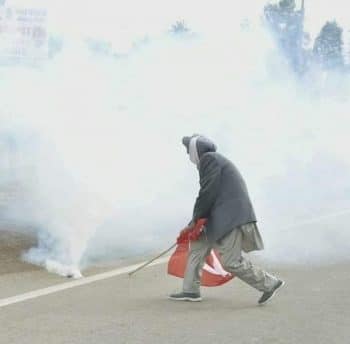 | Dharampal Seel a senior Kisan Sabha leader from Punjab uses his Red Flag to push a tear gas canister 27 November 2020 | MR Online