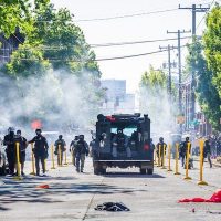 Seattle Police Department utilizes chemical weapons to push protestors back over the “Black Lives Matter” mural on Capitol Hill (Derek Simeone, Flickr)