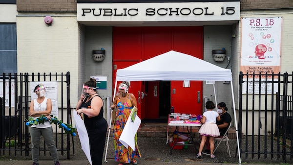 | Teachers prepare an outdoor learning demonstration for students to display methods schools can use to continue on site education during the coronavirus pandemic Sept 2 2020 at PS 15 in the Red Hook neighborhood of the Brooklyn borough of New York John Minchillo | AP | MR Online