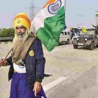 | A Nihang holds the Tricolor during farmers tractor rally as part of their ongoing protest against the new farm laws at Dankaur in Gautam Buddha Nagar District Thursday Jan 07 2021 PTI | MR Online