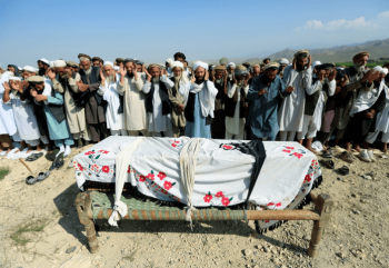 | Relatives pray near a coffin during a funeral on Sept 19 2019 for one of the victims of a drone strike in the Khogyani district of Nangarhar province Afghanistan Source theinterceptcom | MR Online