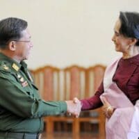 In this file photo dated Dec. 2, 2015 Myanmar military chief General Min Aung Hlaing (L) and National League for Democracy party leader Aung San Suu Kyi (R) shake hands after their meeting at the Commander in-Chief’s office in Naypyidaw.