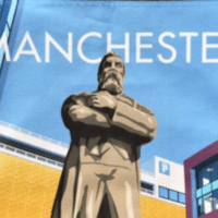 A statue of Engels in Manchester, salvaged by artist Phil Collins depicted on a tea towel