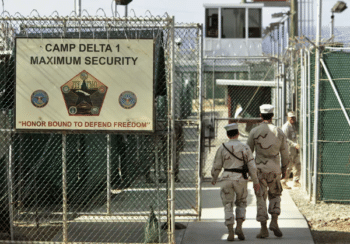 | A photo reviewed by a military official before being made public shows US military guards walking within the Camp Delta military run prison in Guantanamo Bay Cuba AP PhotoBrennan Linsley | MR Online