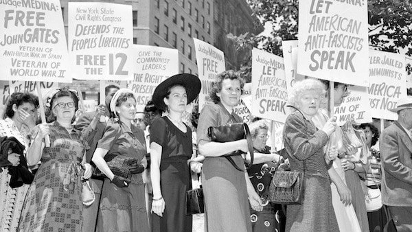 | A mass demonstration is held in front of Federal Courthouse in New York City June 6 1949 to protest against the Communist conspiracy show trial The defendants leaders of the Communist Party USA were charged under the Smith Act Joining the picket line at Foley Square are the wives of three of the twelve defendants starting third from left Lillian Gates wife of Daily Worker editor John Gates Fern Winston wife of CPUSA leader Henry Winston and Elizabeth Hall wife of Ohio CP leader Gus Hall | AP | MR Online