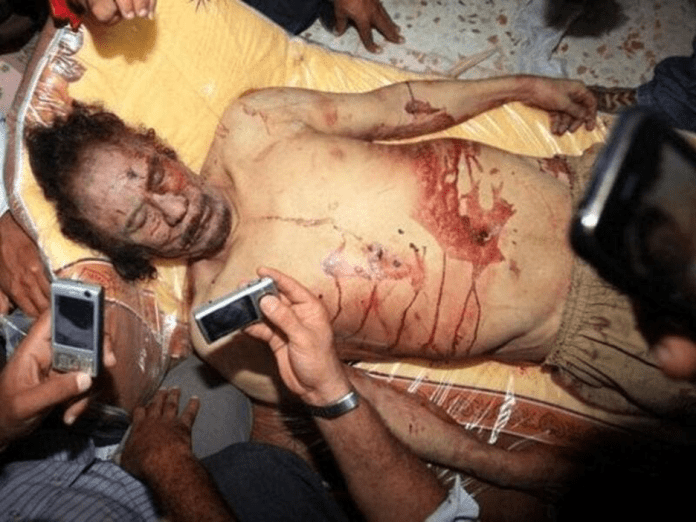 | Libyans snap photos of Qaddafi after his death in Misrata Source albawabacom | MR Online