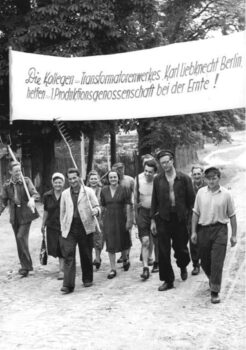 | This photograph shows the arrival of workers from the city carrying a banner that reads Colleagues from the Karl Liebknecht Berlin transformer factory are helping the first production cooperative with the harvest The 194546 democratic land reform in the Soviet Occupation Zone secured food supplies in the dire post war period while also fundamentally changing the system of land ownership in East Germany Roughly 560000 small farms emerged from the redistribution scheme but they were often poorly equipped and supplied Urban industrial and craft enterprises stepped in to help with the harvest in the emerging agricultural cooperatives | MR Online