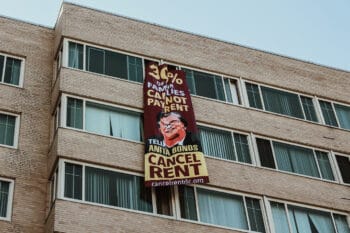 | A banner with a message to DC Councilmember Anita Bonds reading 30 of our families cannot pay rent Eleanor Goldfield | ArtKillingApathycom | MR Online
