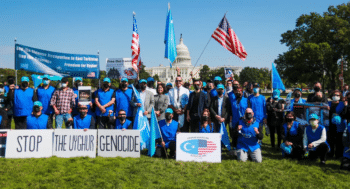 | A demonstration organized by the Uyghur American Association in Washington DC Rep Ted Yoho appears at the center of the photograph with Kuzzat Altay to his right and Rushan Abbas to his left | MR Online