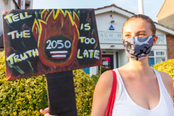| A young woman protests the UKs target of reaching net zero emissions by 2050 which many believe is too late Essex UK August 10 2020 AvpicsAlamy | MR Online