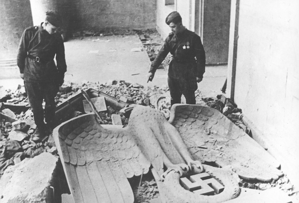 | By April 1945 troops of the anti Hitler coalition had liberated most of the territories occupied by the fascist Wehrmacht The Red Army opened its offensive on the capital of the German Reich and the fierce Battle of Berlin ended with the complete military defeat of Nazi Germany This photograph shows two Red Army soldiers in the Reich Chancellery Hitlers last command post At their feet lies the toppled symbol of fascist power the imperial eagle above the swastika | MR Online