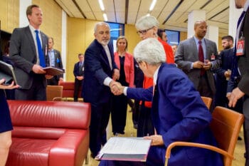 | US Secretary of State John Kerry seated saying goodbye to Iranian Foreign Minister Javad Zarif in Vienna July 14 2015 after Zarif read a declaration of the nuclear agreement in his native Farsi State Department | MR Online