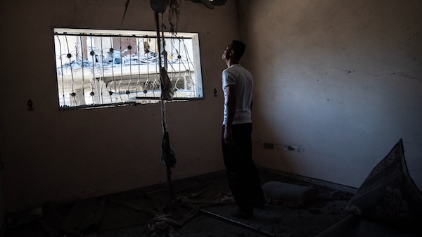 | Mahmoud Ahmed 34 gives a tour of his apartment which was severely damaged by an Israeli airstrike on a neighboring building May 24 2021 in Magazzi the Gaza Strip John Minchillo | AP | MR Online