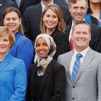 Democratic Representative-elect Ilhan Omar (C) of Minnesota, one of the first Muslim women elected to Congress, poses in the front row with other incoming newly elected members of the U.S. House of Representatives on Capitol Hill in Washington, U.S., November 14, 2018. REUTERS/Kevin Lamarque - RC199D14A510