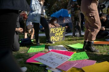 | Protesters write on signs at Echo Park Lake Photo credit Jeremy Lindenfeld WhoWhatWhy | MR Online