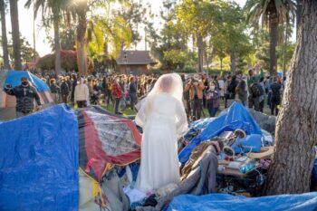 | A homeless Echo Park Lake resident dons her wedding dress during a protest against her eviction Photo credit Jeremy Lindenfeld WhoWhatWhy | MR Online