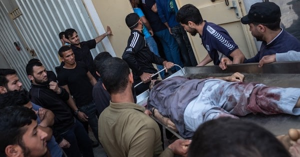 | The body of a Palestinian man named Ahmed Al Shenbari who was killed during an Israeli raid on Beit Hanoun City is taken to a mortuary on May 11 2021 in Gaza Photo Fatima Shbair via Getty Images | MR Online