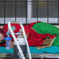 | A COVID 19 patient waits to receive oxygen outside an emergency ward of a hospital in Kathmandu Nepal | MR Online