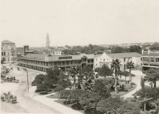 | A photograph of Alamo Plaza from approximately 1910 showing the Hugo Schmeltzer building attached to the Alamo church ADINA EMILIA DE ZAVALA PAPERS DI 10567 THE DOLPH BRISCOE CENTER FOR AMERICAN HISTORY THE UNIVERSITY OF TEXAS AT AUSTIN | MR Online