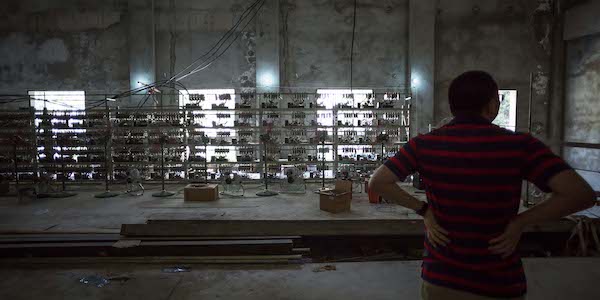 | A man shows off equipment inside a Bitcoin mine near Kongyuxiang Sichuan province Aug 12 2016 Paul Ratje for The Washington Post via Getty ImagesPeople Visual | MR Online
