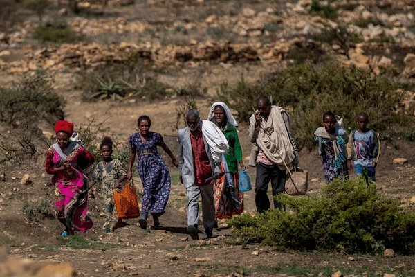 | People walk from a rural area towards the town of Agula in the Tigray region of northern Ethiopia where the Relief Society of Tigray was distributing food Ben CurtisAP | MR Online