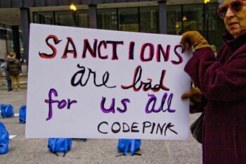 | CodePink activist protests US worldwide sanctions Source globalresearchca | MR Online