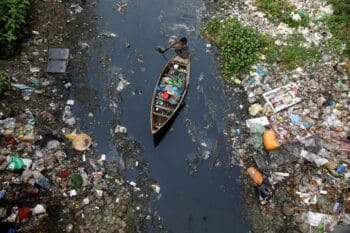 | A boy collects plastic from a stream in Dhaka Bangladesh | MR Online