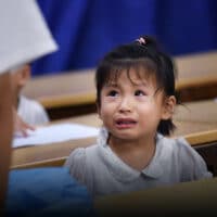 A child student cries at a tutoring school in Hefei, Anhui province, 2018